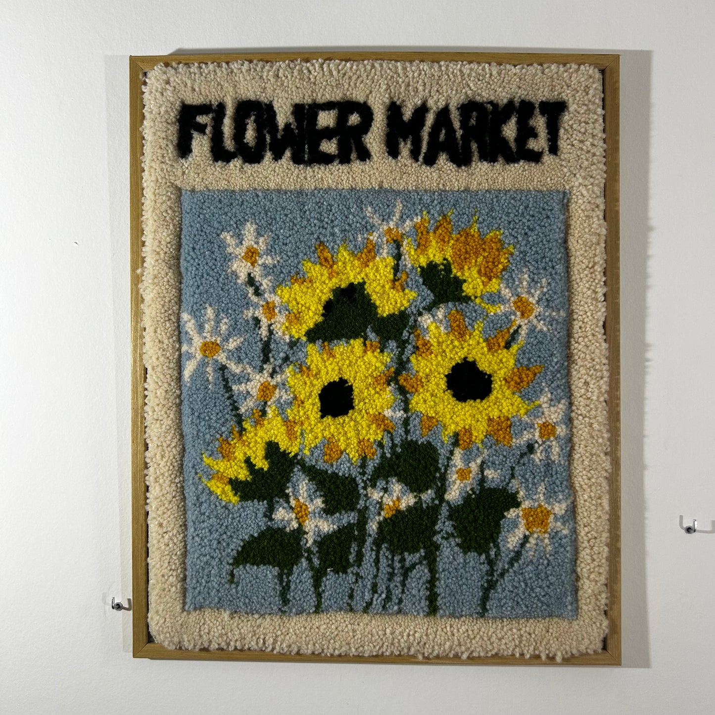 Tableau floral en tufting.